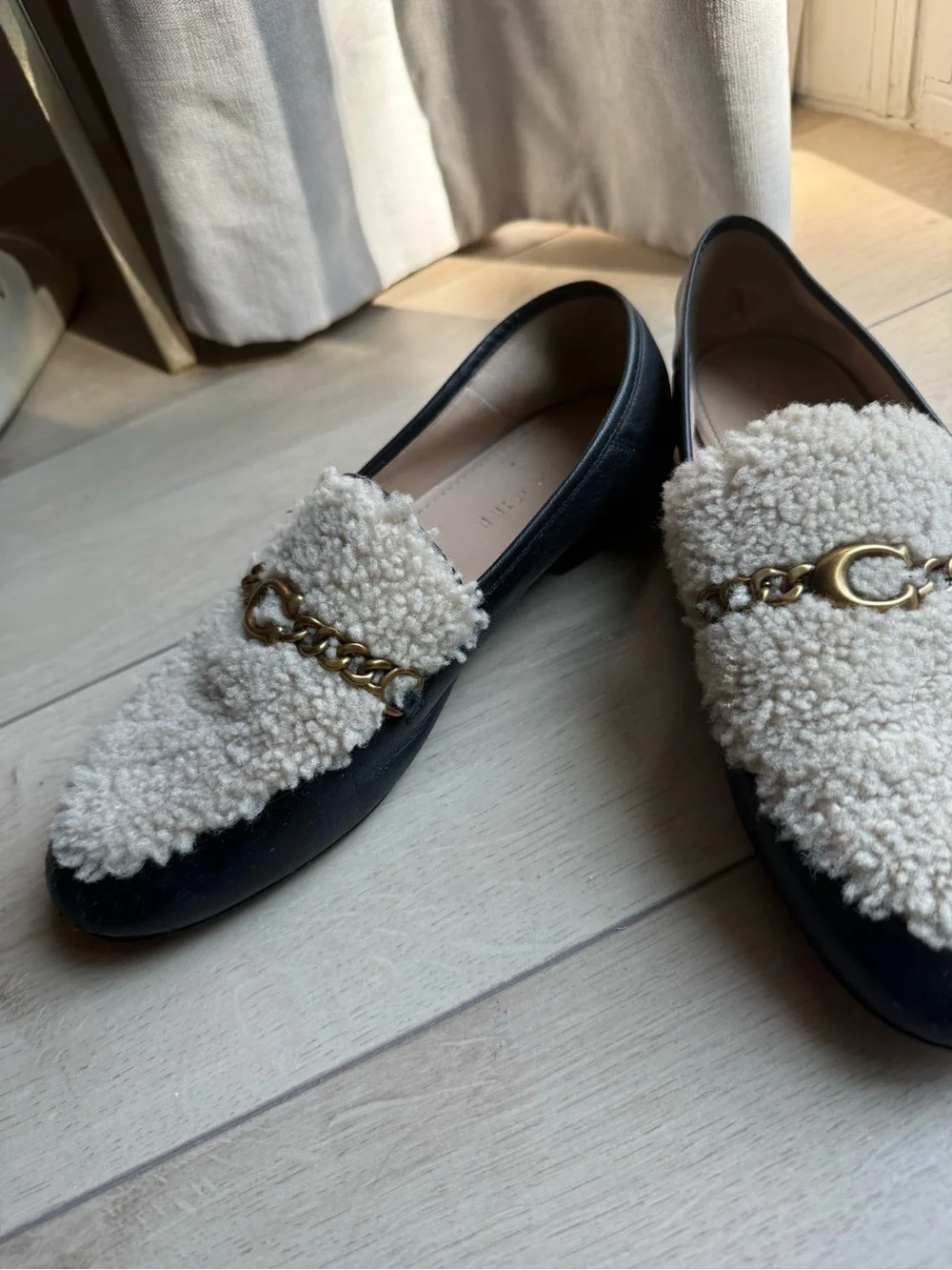 Coach Black Loafers with Cream Shearling and Gold Chain